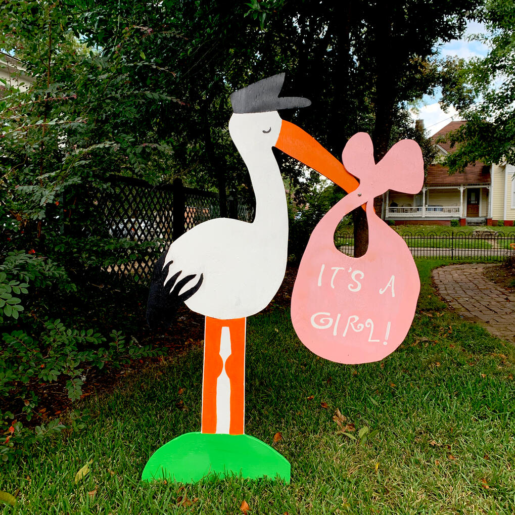 Stork with "It's a girl"